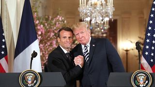 Image: U.S. President Donald Trump and French President Emmanuel Macron hol