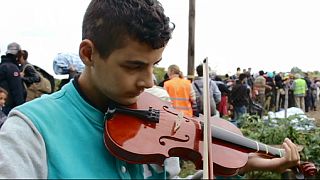 Young musician fleeing Syria dreams of peace