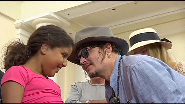 Johnny Depp on hand to help Rio's hard of hearing