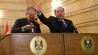 Image: Nouri al-Maliki and George W. Bush