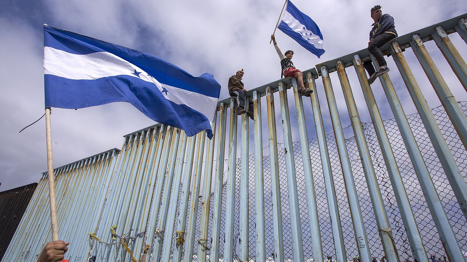 Image: Migrants In Caravan That Travelled Through Mexico Attempt To Be Gran
