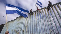 Image: Migrants In Caravan That Travelled Through Mexico Attempt To Be Gran