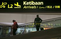 Image: People move inside the Kuala Lumpur International Airport, Malaysia,