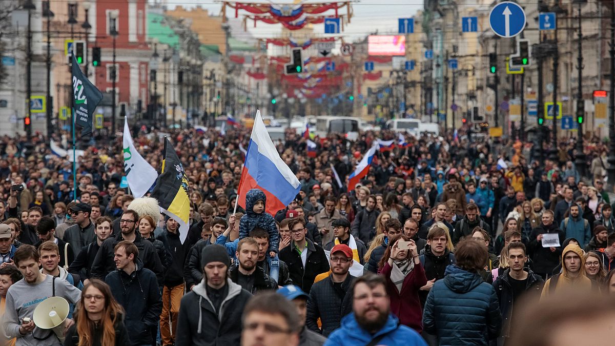 Image: Opposition supporters march in a rally in St. Petersburg