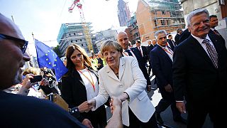 Merkel makes migrant plea as Germany marks 25 years of reunification