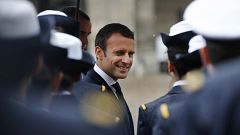 Image: France's President Emmanuel Macron reviews troops