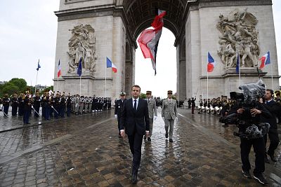 Macron departs after laying a wreath at the tomb of the Unknown Soldier at the Arc de Triomphe after his formal inauguration ceremony as French President. 