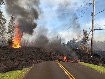 Lava blocks a road Saturday near lower from Kilauea volcano\'s East Rift Zone on on the Big Island of Hawaii.