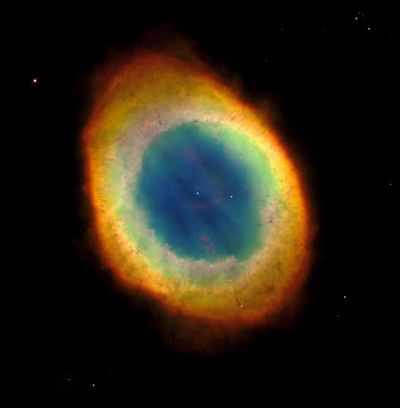 The NASA Hubble Space Telescope captured this view of the most famous of all planetary nebulae: the Ring Nebula (M57). In this October 1998 image, the telescope has looked down a barrel of gas cast off by a dying star thousands of years ago.