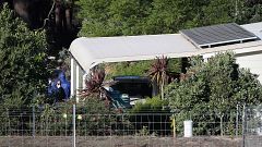 Image: Police forensics investigate the death of seven people