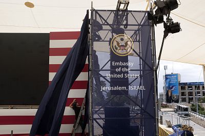 Israeli workers prepare the ceremony stage inside the U.S. consulate that will act as the new embassy.