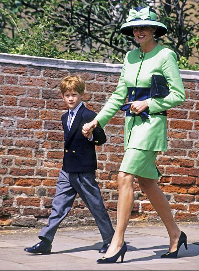 Diana, Princess of Wales and Prince Harry walk to St George\'s Chapel to attend the wedding of  Lady Helen Windsor to Tim Taylor in Windsor, England, on July 18, 1992.