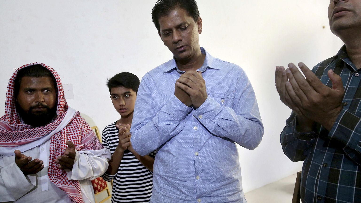 Image: Abdul Aziz Sheikh, center, father of Sabika Sheikh