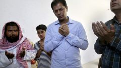 Image: Abdul Aziz Sheikh, center, father of Sabika Sheikh