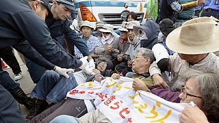 Protesters clash with police over planned US airbase in Japan