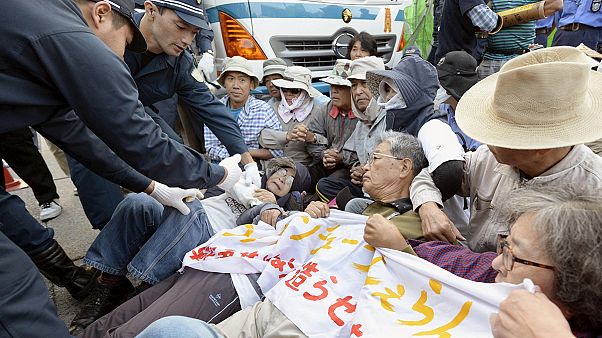 Protesters clash with police over planned US airbase in Japan Protesters clash with police over planned US airbase in Japan