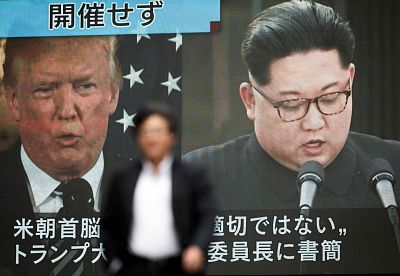 A video screen in Tokyo showing Donald Trump and Kim Jong Un.