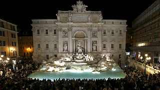 Trevi fountain's waters flow again as landmark re-opens after facelift