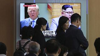 Image: President Donald Trump and North Korean leader Kim Jong Un appear on
