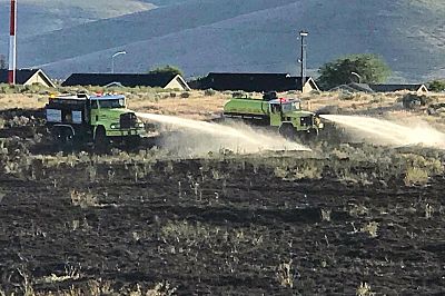 Fire crews respond to a 5-acre wildfire in Ephrata, Washington, which authorities say was started by a man who was burning a U.S. flag blanket.