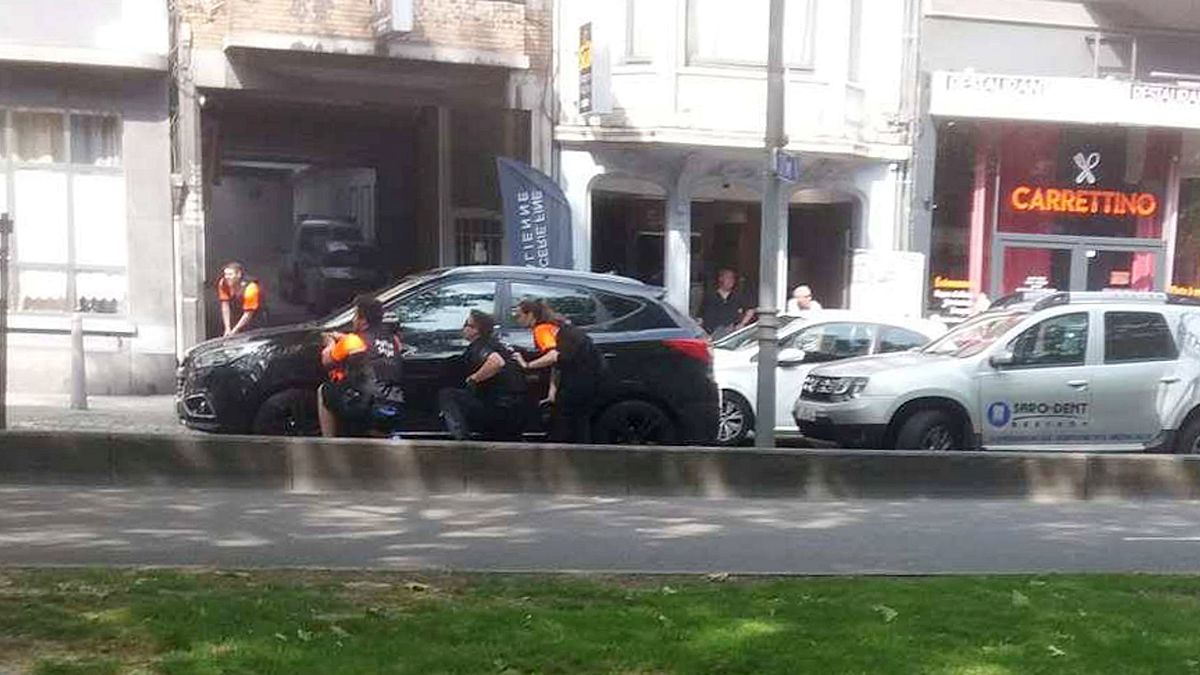 Image: Police officers are seen on the scene of a shooting in Liege