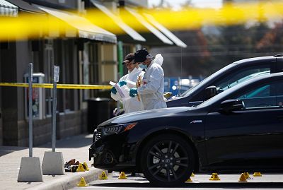 Police forensic investigators collect evidence at Bombay Bhel restaurant in Mississauga, Ontario, Canada on May 25, 2018.