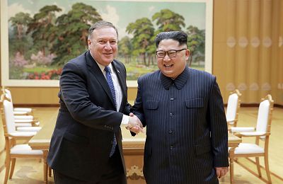 North Korean leader Kim Jong Un and U.S. Secretary of State Mike Pompeo shake hands at the Workers\' Party of Korea headquarters in Pyongyang on May 8, 2018.