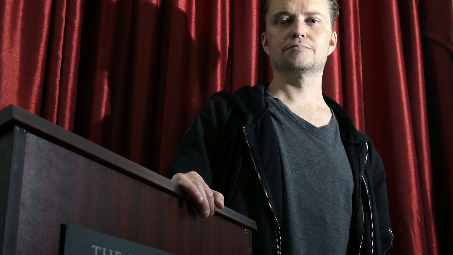 Image: Lucien Greaves stands inside the international headquarters of the S
