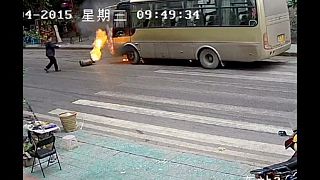 Rolling gas cylinder causes bus fire in southwest China