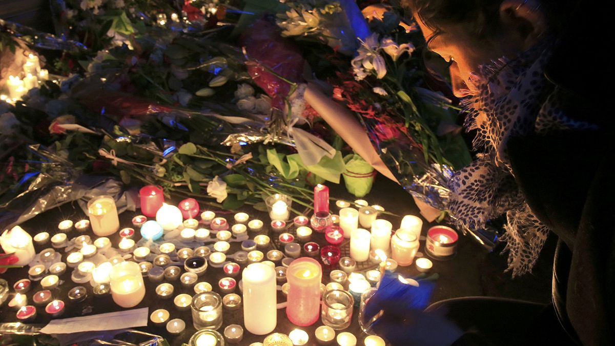 Parisians united in grief hold vigils at scene of attacks