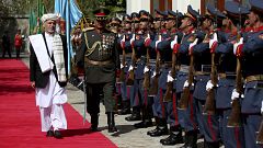 Image: Afghan President Ashraf Ghani inspects an honor guard at the preside