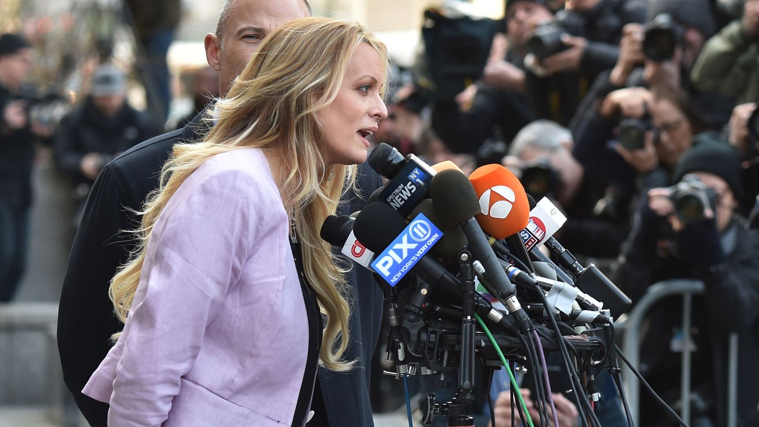 Image: Stormy Daniels speaks to members of the media outside U.S. Federal C