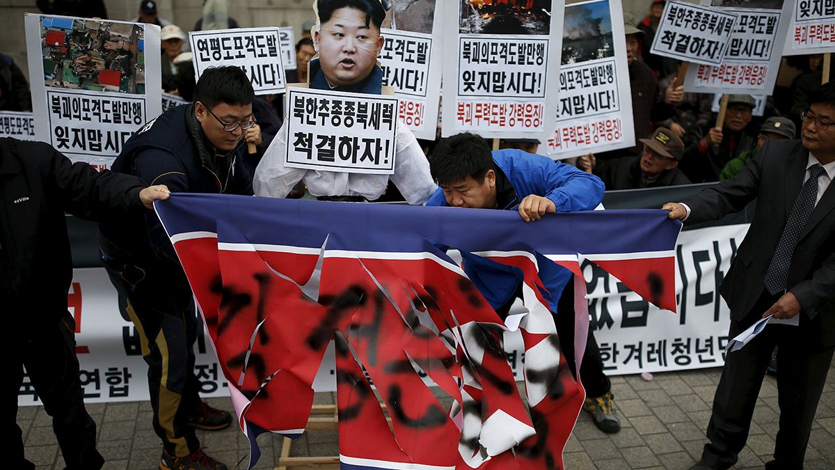 North Korea protesters beat effigy of Kim Yong-un