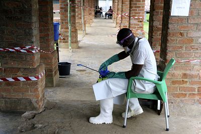A health care worker wears virus protective gear at a treatment center in Bikoro, Democratic Republic of Congo. Congo\'s latest Ebola outbreak has spread to a city of more than 1 million people, a worrying shift as the deadly virus risks traveling more easily in densely populated areas.