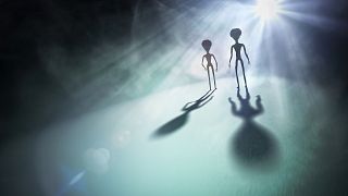 Image: Spooky silhouettes of aliens and bright light in background. 3D rend