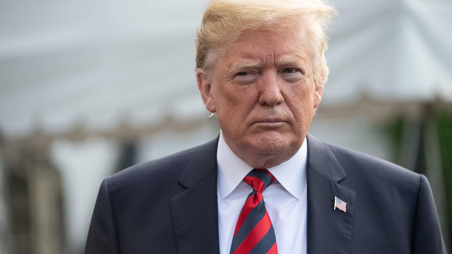 Image: Trump speaks to the press before leaving the White House