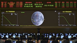 Image: A giant electronic screen displays the mission operation information