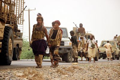 Saudi-backed Yemeni forces travel in convoy toward the western port city of Hodeidah, Yemen, 15 June 2018.