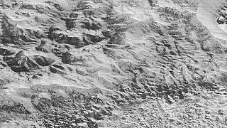 Pluto's mountains, craters and ice fields revealed close-up by New Horizons