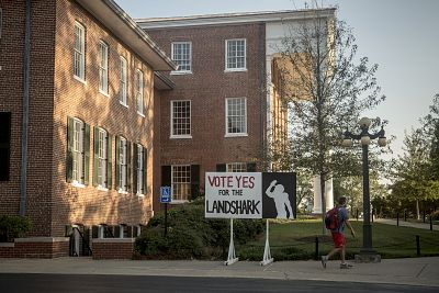 A sign outside the Lyceum encourages students to support a mascot change.