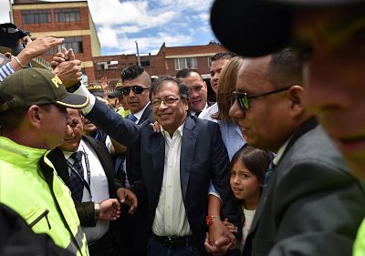 Presidential candidate Gustavo Petro waves to supporters after casting his vote during the second round of presidential elections Sunday in Bogotá, Colombia.