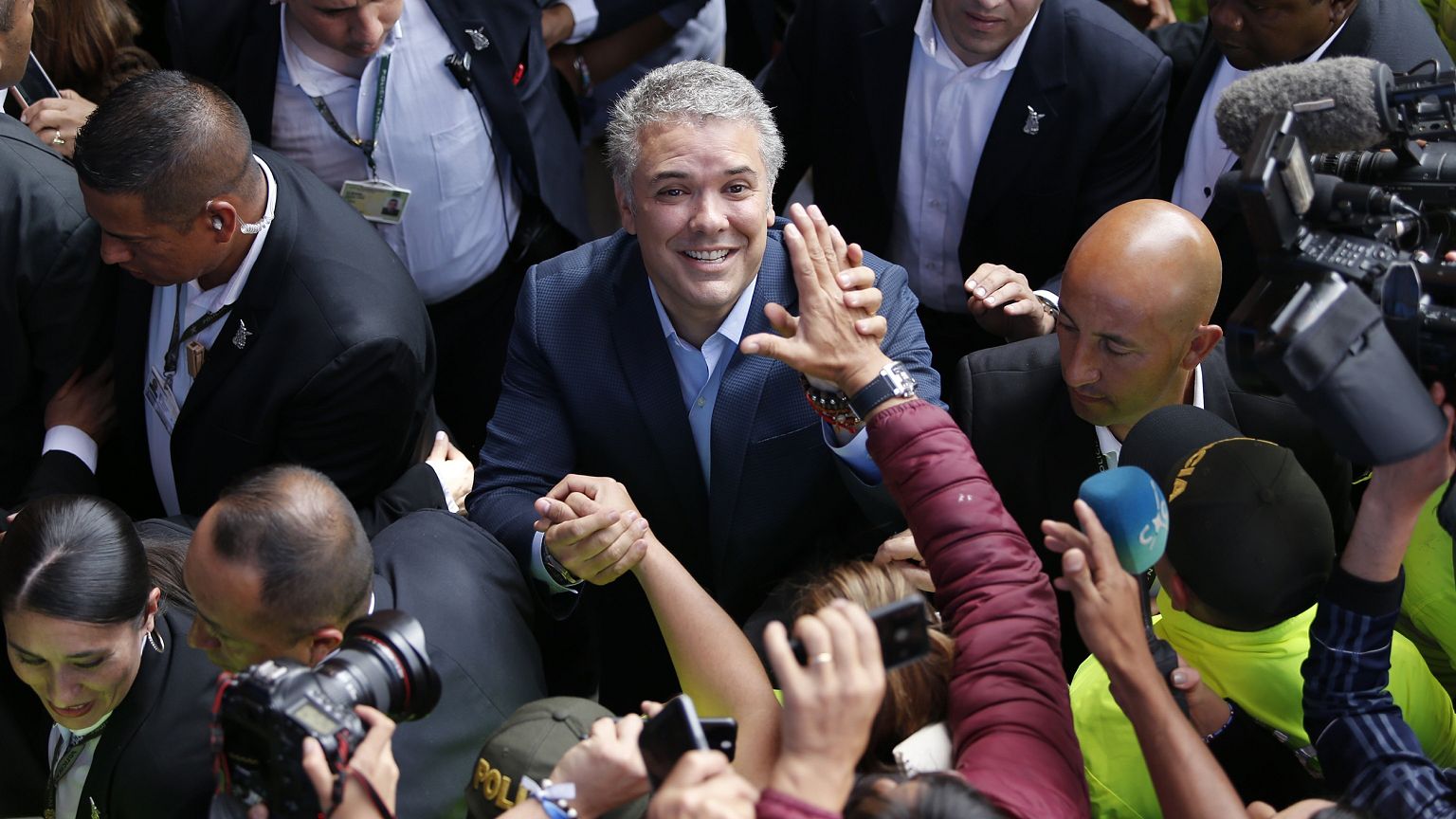 Image: Ivan Duque, candidate of the Democratic Center party, greets support
