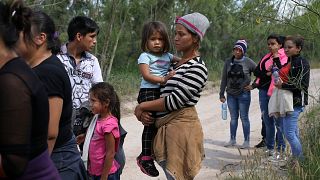 Image: Family units who illegally crossed the Mexico-U.S. border turn thems
