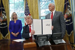 Image: President Trump Signs Executive Order Ending Family Separations At B