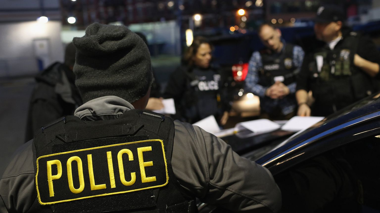 Image: U.S. Immigration and Customs Enforcement (ICE) officers prepare for 