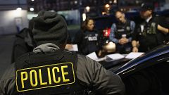 Image: U.S. Immigration and Customs Enforcement (ICE) officers prepare for 