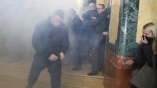 Watch: dramatic scenes as MP sets off smoke bomb in Kosovo parliament