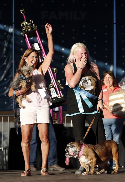 Megan Brainard (on right) with Zsa Zsa, the winner of the 2018 Worlds Ugliest Dog Contest stands with 2nd place winner Scamp and Scamp\'s owner Yvonne Morones on June 23. 