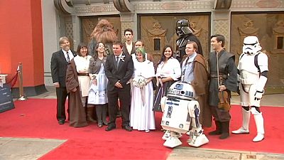 Star Wars fans tie the knot in line to see The Force Awakens