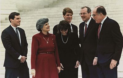 Supreme Court Chief Justice William Rehnquist, right, as he talks with soon-to-be-sworn-in Justice Anthony Kennedy, Kennedy\'s wife Mary and Kennedy\'s children, Justin, left, Gregory and Kristin on the steps of the Supreme court on Feb. 18, 1988.